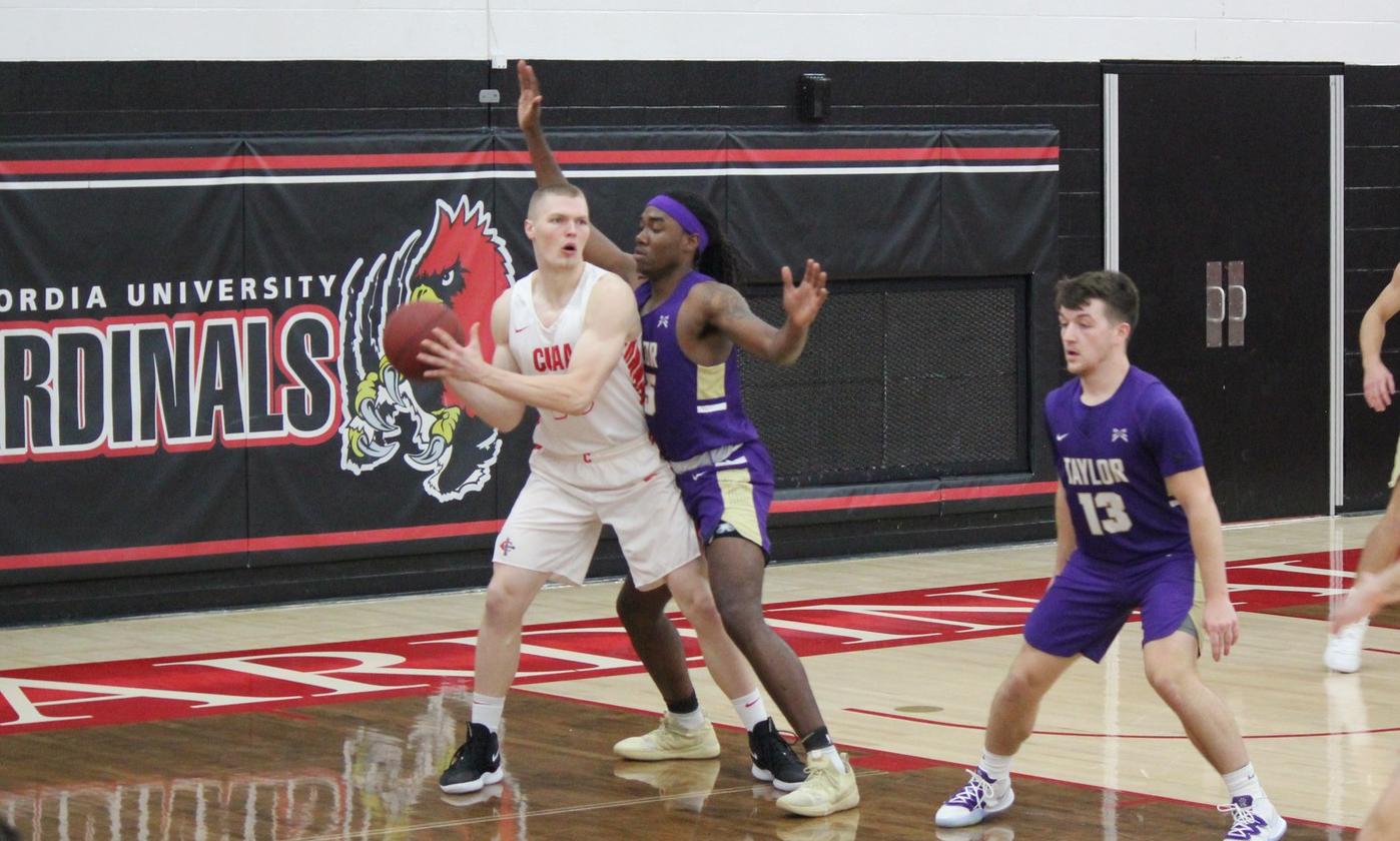 Men's basketball drops season opener to Taylor 98-86