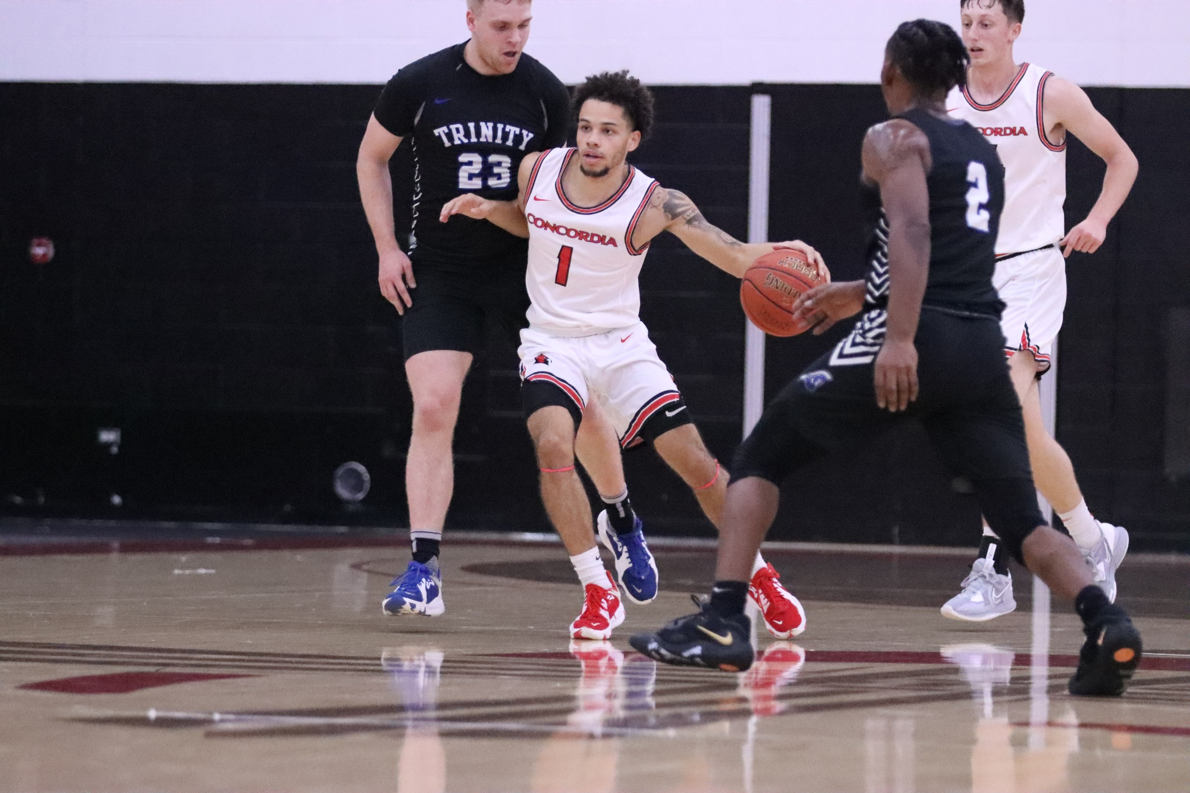 Men's Basketball falls in season opener against Trinity International